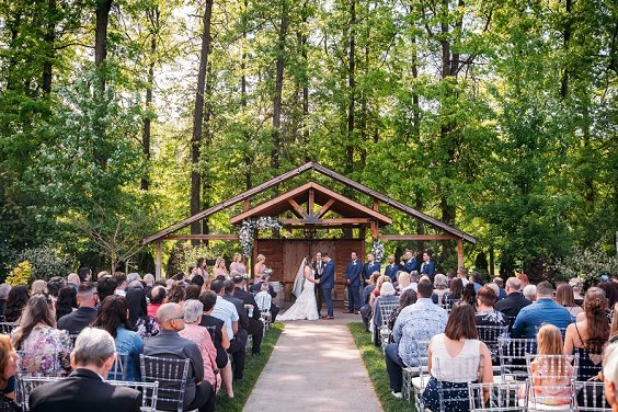 bride and groom walking down isle